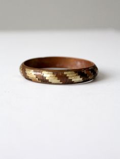 "This is a 1970s vintage mixed metal cuff bangle  The copper, brass, and silver tone slip-on bracelet has a basket weave design.  CONDITION In good condition with wear consistent with age and use. There is a small dent and some scuffs.  MEASUREMENTS Width:  1/2\"  .. 1.3 cm Exterior Circumference:  9.25\"  ..  23.5 cm Interior Diameter: 2.625\" ...  6.7 cm 91831" Vintage Gold Bangle Made Of Copper, Brown Copper Bangle, Vintage Copper Bangle, Vintage Gold Copper Bangle, Vintage Gold-colored Copper Bangle, Vintage Copper Bangle In Gold Color, Victorian Shoes, Hippie Boots, Suede Belt