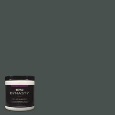 a can of dymasty paint on a dark gray background with the word dymasty written in white