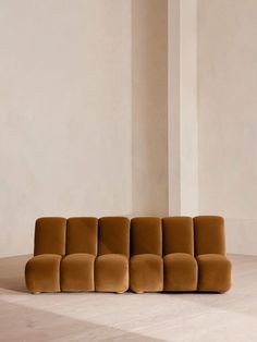 a couch sitting on top of a hard wood floor