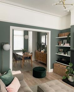 a living room filled with furniture and a flat screen tv