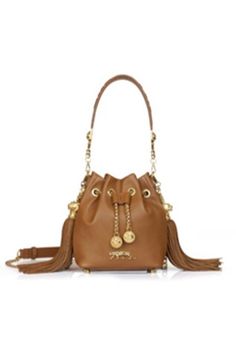 Mustard tan nani bucket bag with gold-tone signature Royal Bengal Tiger carved logo, braided drawchord with medallions and embossed strap handle. - Aza Fashions Sabyasachi Logo, Bohemian Glam, Miranda Priestly, Silver Clutch, Beige Bag, Pink Chevron, Brown Handbag, Handbags Online, Designer Wear