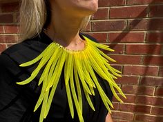 Elevate your style with this bold and unique Radiant Yellow Statement Necklace. Crafted from high-quality mesh material, this stunning piece features vibrant yellow strands radiating from a central collar, creating an eye-catching fan-like effect. Perfect for adding a pop of color to any outfit, this necklace is both lightweight and comfortable, making it ideal for special occasions or everyday wear. Stand out from the crowd and express your individuality with this avant-garde accessory. **Key F Unique Yellow Choker Necklace, Yellow Choker Jewelry For Summer, Unique Yellow Necklace For Party, Yellow Choker Necklace For Summer, Handmade Yellow Necklace For Party, Yellow Summer Choker Necklace, Large Necklace, Bib Necklaces, Necklace Statement