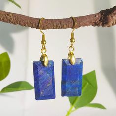 Welcome to a piece of timeless beauty that transcends the ordinary. Introducing our Rectangular Lapis Lazuli Earrings, a perfect blend of elegance and mystique. These earrings are more than just an accessory; they are a statement of your unique style and a tribute to the ancient allure of Lapis Lazuli. Material: Genuine Lapis Lazuli, Real gold plated metal Weight: 1 piece about 3.5g The length of the stone is about 3.5cm/1.37in and the width is about 2.5cm/0.98in. The earhook is of moderate length to ensure that it is stable and comfortable to wear. Design: Each Lapis Lazuli stone is uniquely cut and polished to showcase its inherent clarity and brilliance.  Stone Details: Each earring is a showcase of the natural beauty of Lapis Lazuli, known for its deep blue color with golden flecks of Rectangular Single Earring For Gift, Oblong Jewelry With Matching Earrings For Gifts, Oblong Jewelry Set With Matching Earrings As Gift, Jewelry Set With Matching Earrings As A Gift, Gemstone Drop Earrings, Lapis Lazuli Earrings, Natural Stone Earrings, Lapis Lazuli Stone, Earrings Minimalist