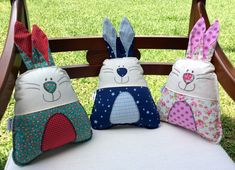 three bunny bags sitting on top of a chair