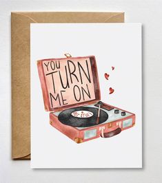 a card that says you turn me on with an open suitcase and record player inside