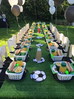 a soccer themed party with food and balloons