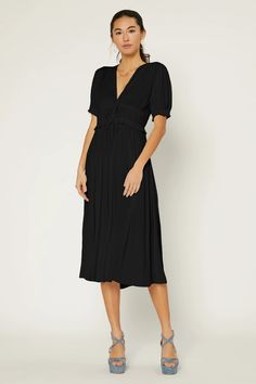 This V-neck dress hugs the figure with pleating at the bodice before flowing to a shin-skimming hem. Slender ties draw in the midsection, delivering an elegant finish.  On average, customers say it fits large •V-neck •Short sleeves with elastic  •Pleated bodice •Adjustable ties DIMENSIONS •Standard: 51" L Item number 2 V-neck Dress With Fitted Waist For Brunch, Elegant Short Sleeve V-neck Dress For Brunch, Chic Knee-length V-neck Dress With Gathered Sleeves, Spring V-neck Midi Dress With Pleated Waist, Elegant Pleated V-neck Dress With Short Sleeves, Viscose Midi Dress With Gathered Sleeves, Belted Midi Dress With V-neck, Solid Color Belted V-neck Midi Dress, Belted V-neck Midi Dress