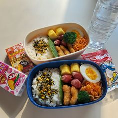 two bowls filled with different types of food next to each other on a white table