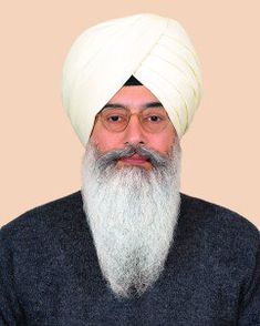 an old man with a white turban on his head