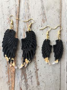 Handmade wings resin dangle earrings, black & gold leaf, bigger or small. Bespoke, statement, quirky, unique jewellery for her A beautiful design of dangle earrings, they are made of black resin and imitation gold flakes, on gold plated ear hooks (stainless steel). The surface is engraved to recreate the pattern of the wings feathers. Choose from bigger or small size. Sizes: BIgger: Drop length is approx 8.5cm, width is approx 2.5cm. Small: Drop length is approx 6.5cm, width is approx 1.5cm Both models are 3mm thick, however light and comfortable to wear. Wings Feathers, Black Earrings Dangle, Gold Leaf Earrings, Golden Glitter, Black Resin, Glitter Hearts, Gold Flakes, Earrings Black, Jewelry For Her