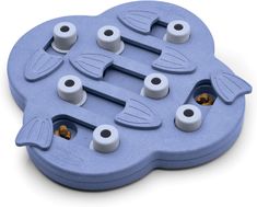 a blue plastic toy with four holes in the middle and two fish on each side