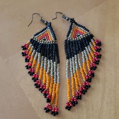 Seed Bead Earrings. Never Worn. Black, Tan, Orange, Pink And Gold Beads. Orange Gold, Seed Bead Earrings, Gold Beads, Pink And Orange, Pink And Gold, Beaded Earrings, Seed Beads, Seeds, Jewelry Earrings