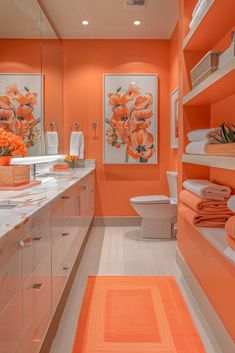 a bathroom with orange walls and white counters