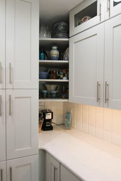 the kitchen is clean and ready to be used as a storage area for dishes or drinks