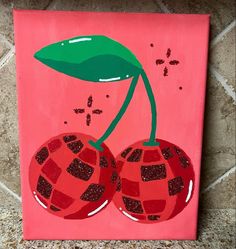 a painting of two cherries on a pink background with glitters and green leaves