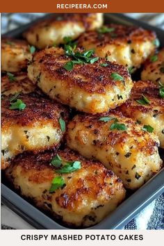 crispy mashed potato cakes in a baking pan with herbs on top and text overlay