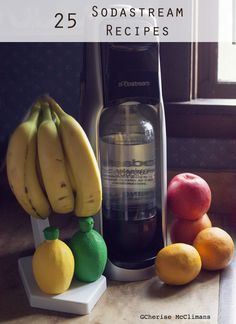 there are some fruit on the counter next to an electric juicer