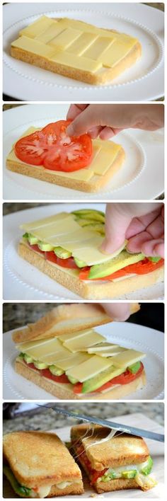 sandwiches with cheese, tomato and lettuce on them are being cut in half