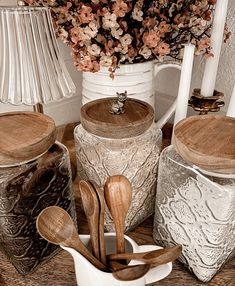 kitchen utensils and wooden spoons on a table