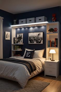 a bed room with a neatly made bed and some pictures on the wall above it