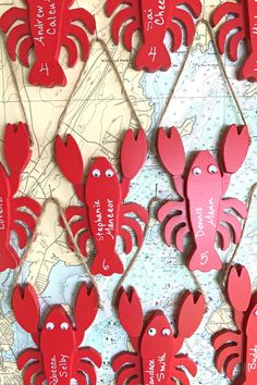 red crabs are hanging on a map with words written in the shape of heart shapes