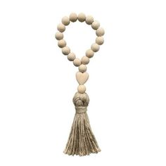 a wooden beaded necklace with tassels and beads hanging from it's end