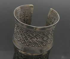 925 Sterling Silver - Vintage Flower Patterned Dark Tone Cuff Bracelet - BT7318  925 Sterling Silver - Vintage Flower Patterned Dark Tone Cuff Bracelet - BT7318  Jewelry Type:         Bracelet   Metal Type:            925 Silver  Metal Size:             6.75" Length  2" Height   Stone Type:            N/A  Condition:              N/A  Jewelry Weight:     67.8 Grams  PLEASE NOTE: THIS ITEM IS PRE-OWNED. ALTHOUGH MOST ITEMS ARE IN VERY GOOD CONDITION, SOME MAY NEED CLEANING AND/OR MINOR REPAIRS. WE MAKE A VERY STRONG EFFORT TO UPLOAD CLEAR PICTURES. PLEASE INSPECT ALL PICTURES AND ASK ALL QUESTIONS YOU MAY HAVE PRIOR TO MAKING A PURCHASE. NOT ALL STONES ARE GENUINE, SOME ARE ENHANCED OR CREATED. Funky Jewellery, Clear Pictures, Jewelry Aesthetic, Bracelet Metal, Funky Jewelry, Metal Bracelets, Antique Rings, Metal Jewelry, Vintage Flowers