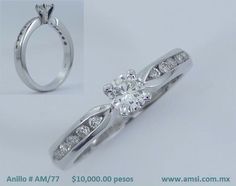 an image of a diamond ring with diamonds on the band and side stones set in white gold