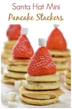 strawberries and marshmallows are stacked on top of pancakes