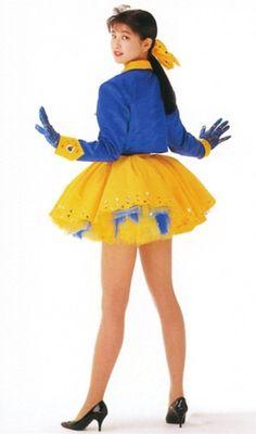 a woman in a blue and yellow costume