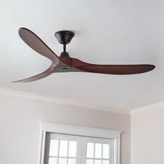 a ceiling fan mounted to the ceiling in a room