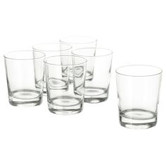 a set of six glasses sitting next to each other