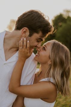 a man and woman standing close to each other