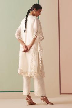 Ivory silk organza kurta with tonal beads and cutwork embroidery.
Components: 1
Pattern: Embroidered
Type Of Work: Beads, Cutwork
Neckline: Round
Sleeve Type: Flared Sleeves
Fabric: Silk organza, Lining : 100% Cotton
Color: Ivory
Other Details: 
Model Height : 5 ft 6 inches, wearing size S
Note : Pant worn by the model is not for sale.
Occasion: Sangeet - Aza Fashions Elegant Lace Sets With Dupatta, Cream Organza Sets With Lace Work, Elegant Designer Lace Work Sets, Traditional Lace Sets With Pearl Embroidery, Elegant Organza Sets With Lace Work, Elegant Cream Organza Set, Elegant Silk Dupatta With Lace Work, White Organza Sets With Lace Work, Elegant Lace Dupatta With Pearl Embroidery