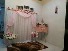 a room decorated with pink and white flowers