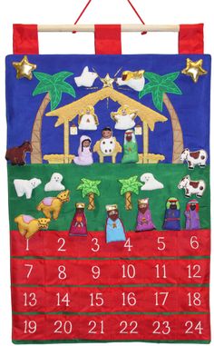 a christmas calendar hanging on a wall with the nativity scene in red and green