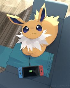 a nintendo wii game controller sitting on top of a couch next to a pikachu