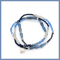 One long strand of colorful beads in shades of blue from navy to sky, plus milky-white round beads and metallic rondels line this stretchy strand that works as a wrap bracelet or a choker! About 18" long, stretches to fit most wrists, no clasp. from Kole Designs Blue Wrap Bracelet With Spacer Beads, Blue Multi-strand Hand-strung Bracelet, Adjustable Blue Wrap Bracelet With Faceted Beads, Blue Hand-strung Multi-strand Bracelet, Blue Multi-strand Hand-strung Beaded Bracelets, Flexible Blue Beaded Bracelets, Adjustable Blue Wrap Bracelet With Round Beads, Blue Beaded Flexible Stretch Bracelet, Flexible Blue Beaded Stretch Bracelet