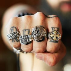 Introducing the Layered Cross Ring—a bold statement piece in two-toned sterling silver and brass accents that showcase strength and excellence. This eye-catching cross of servitude is sure to add a bold transformation to your wardrobe. Derived from a symbol of loyalty, honor and brotherhood in battle, and more recently worn by outlaw motorcycle bikers, it has come to signify a rebellious nature, making it an ideal choice for someone looking to inject a unique style into their wardrobe.Change the Hand Forged Symbolic Rings For Collectors, Symbolic Hand Forged Rings For Collectors, Silver Brass Promise Jewelry, Silver Brass Jewelry For Promise, Hand Forged Vintage Promise Jewelry, Silver Symbolic Skull Ring, Symbolic Silver Skull Ring, Symbolic Hand Forged Ring Jewelry, Symbolic Etched Jewelry For Promise