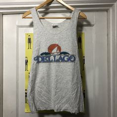 "Vintage Del Lago Resort Hanes Heavyweight Tank Top 99% cotton 1% other.  Made in the USA.  Tag says size medium.  Bust measures 20\" flat across armpit to armpit and the length from shoulder seam to bottom along the side is 26.5\".  There are some small light spots but overall good shape." Floral Wrap Skirt, Light Spots, Chore Coat, Chattanooga Tn, Orange Blouse, Brown Shorts, Small Light, Wrap Skirt, Linen Blend