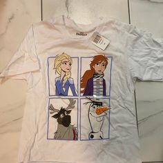 a t - shirt with the characters from frozen princesses on it sitting on a counter