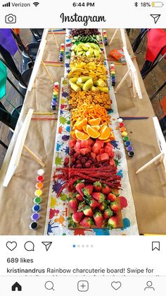 a long table topped with lots of fruit