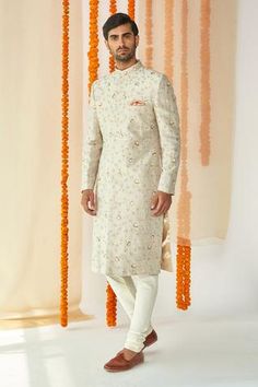 Light grey sherwani with floral embroidery. Comes with pants.
Components:2
Embroidery
Neckline:Mandarin collar
Sleeve Length:Full
Fabric:Viscose Polyester
Color:Grey
Welt pocket
Side slits
Hook front closure
Note: Pocket square worn by the model is not for sale - Aza Fashions Wedding Sherwani With Floral Embroidery And Straight Kurta, Diwali Floral Embroidered Sherwani For Reception, Diwali Reception Sherwani With Floral Embroidery, Floral Embroidered Sherwani For Reception During Eid, Ceremonial Sherwani With Floral Embroidery, Grey Sherwani, Embroidered Sherwani, Embroidery Neckline, Not For Sale