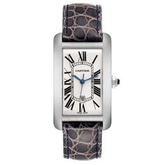 Cartier Tank Americaine Large White Gold Mens Watch W2603256 Box Card. Automatic self-winding movement. 18K white gold case 26.6 x 45.1 mm. Circular grained crown set with faceted blue spinel. . Scratch resistant sapphire crystal. Silvered guilloche dial with black Roman numerals. Blued steel sword shaped hands. Date calendar window at 6 o'clock aperture. Light purple leather strap with an 18K white gold tang buckle. Cartier Tank Watch Woman Silver, Cartier White Watch With Metal Dial, Cartier French Tank Watch, Cartier Automatic Rectangular Watch, Cartier Tank Americaine, High End Watches, Gold Watch Men, Cartier Tank, Blue Steel