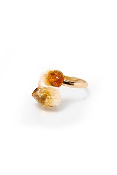 Origin: Brazil Add some brightness to your outfit with this raw citrine ring. Citrine is known as a stone of joy and happiness, which makes it the perfect accessory to help you radiate positive vibes. It's also associated with the sacral and solar plexus chakras, meaning it can help stimulate creativity, passion, and intimacy. Made with a 100% pure, natural, raw citrine crystal and gold-plated copper base, this ring is adjustable to fit any sized finger. Plus, it comes with a premium storage pou Gemstone Ring For Meditation, Spiritual Open Crystal Promise Ring, Adjustable Orange Jewelry Ring, Orange Gemstone Spiritual Rings, Spiritual Citrine Ring Jewelry, Spiritual Orange Gemstone Rings, Healing Natural Stones Open Crystal Ring, Adjustable Spiritual Crystal Ring, Adjustable Open Crystal Ring With Spiritual Style