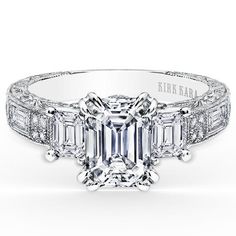 an emerald cut diamond engagement ring with side stones