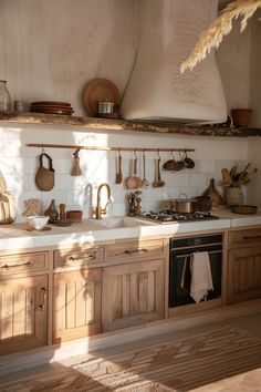 a kitchen filled with lots of wooden cabinets and counter top space next to an oven