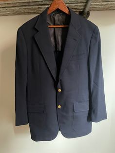 Vintage Brooks Brothers 346 gold 2 button navy blazer. Made in the USA. dry clean only. Hand constructed. 3250 55 regular(vintage 44reg). Lightly padded. 22" armpit to armpit. 32" long. 34" sleeve length from center back to cuff. 100% wool Gold Notch Lapel Blazer For Tailoring, Gold Single Breasted Blazer For Business, Classic Tailored Gold Suits, Gold Single Breasted Blazer With Notch Lapel, Classic Gold Blazer With Suit Collar, Classic Gold Business Outerwear, Gold Classic Formal Blazer, Classic Gold Suit With Notch Lapel, Classic Single Button Sport Coat