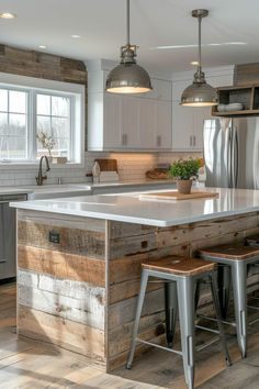 a kitchen with an island made out of wooden planks and metal barstools