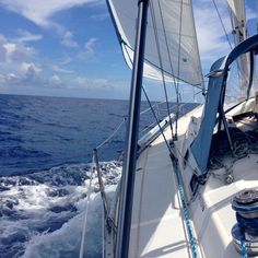 the front end of a sailboat sailing in the ocean